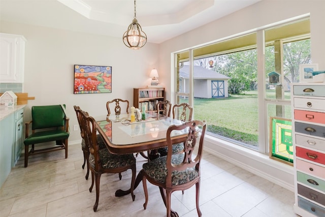 305 Brookview Dr, Decatur, TX 76234 - dining area with a raised ceiling, baseboards, and light tile patterned floors