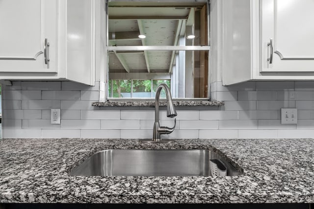 5225 Fallworth Ct, Fort Worth, TX 76133 - kitchen featuring a sink, white cabinets, dark stone countertops, and tasteful backsplash