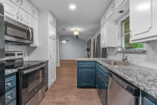 5225 Fallworth Ct, Fort Worth, TX 76133 - kitchen featuring appliances with stainless steel finishes, blue cabinetry, a sink, white cabinets, and recessed lighting