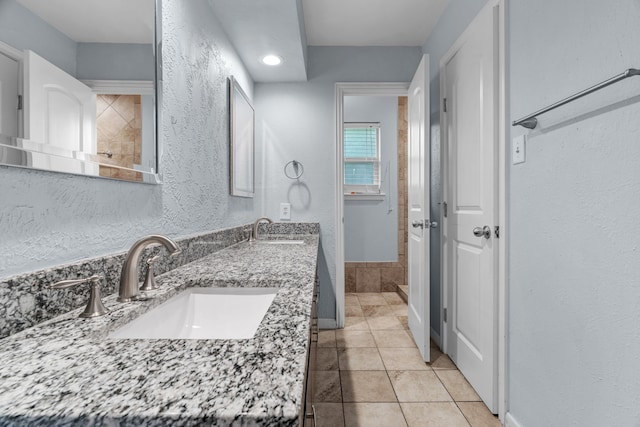 5225 Fallworth Ct, Fort Worth, TX 76133 - full bath with tile patterned flooring, a textured wall, recessed lighting, baseboards, and double vanity
