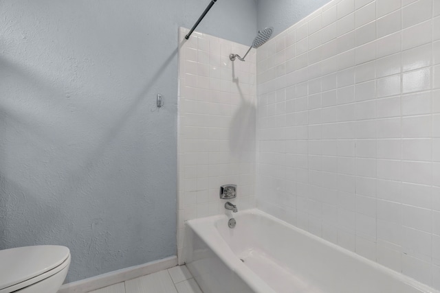 5225 Fallworth Ct, Fort Worth, TX 76133 - bathroom with a textured wall, toilet, shower / bath combination, tile patterned flooring, and baseboards