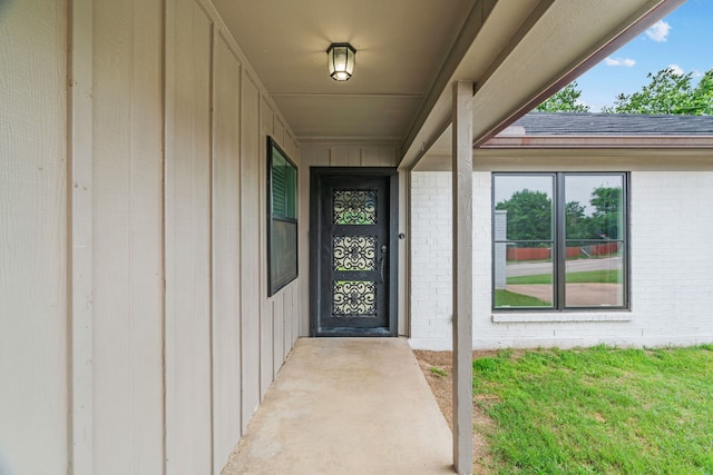 5225 Fallworth Ct, Fort Worth, TX 76133 - entrance to property with brick siding, board and batten siding, a yard, and a shingled roof