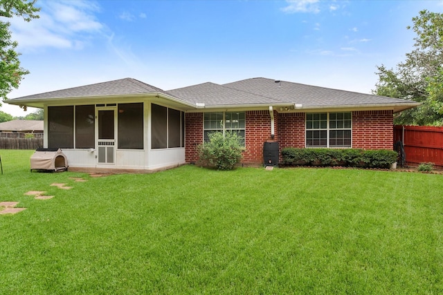 200 Oakview Cir, Mexia, TX 76667 - back of house with a sunroom, roof with shingles, and brick siding