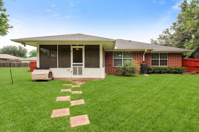 200 Oakview Cir, Mexia, TX 76667 - back of house featuring a sunroom, a shingled roof, and brick siding