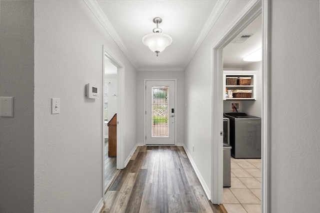 200 Oakview Cir, Mexia, TX 76667 - doorway to outside with separate washer and dryer, wood finished floors, crown molding, and baseboards