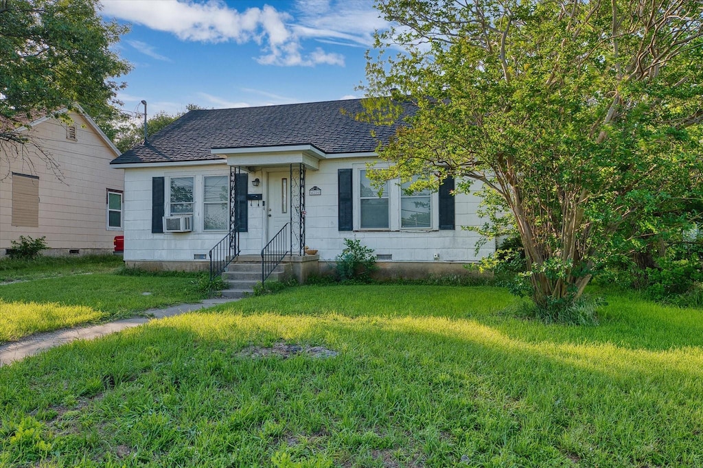 4216 Beverly Dr, Waco, TX 76711 - view of front of home with crawl space, a shingled roof, a front yard, and cooling unit
