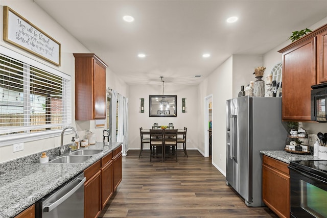 8537 Gray Shale Dr, Fort Worth, TX 76179 - kitchen featuring a sink, black appliances, recessed lighting, dark wood-style flooring, and brown cabinetry
