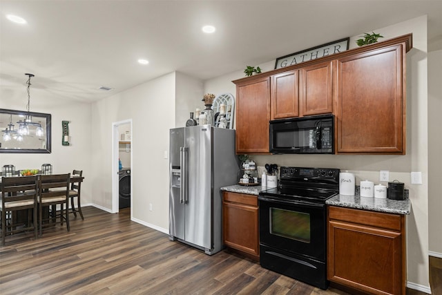 8537 Gray Shale Dr, Fort Worth, TX 76179 - kitchen with black appliances, washer / clothes dryer, dark wood finished floors, light stone counters, and recessed lighting