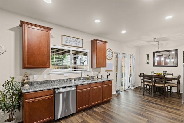 8537 Gray Shale Dr, Fort Worth, TX 76179 - kitchen with stainless steel dishwasher, a sink, dark wood-style flooring, recessed lighting, and brown cabinetry