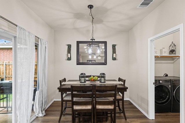 8537 Gray Shale Dr, Fort Worth, TX 76179 - dining space featuring washing machine and dryer, dark wood finished floors, baseboards, and a chandelier