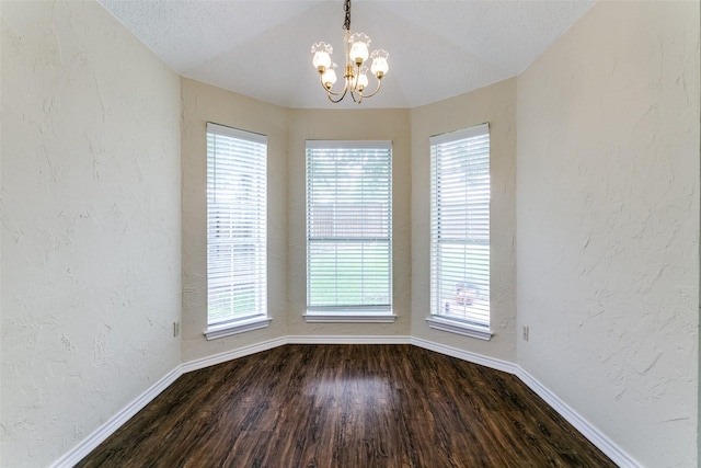 905 Wildwood Cir, Grapevine, TX 76051 - unfurnished room featuring a chandelier, baseboards, dark wood-style floors, healthy amount of natural light, and a textured wall