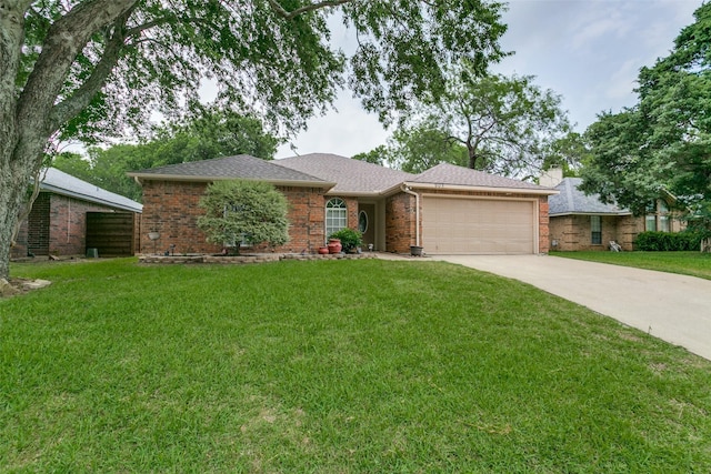 905 Wildwood Cir, Grapevine, TX 76051 - ranch-style home featuring an attached garage, driveway, a front lawn, and brick siding