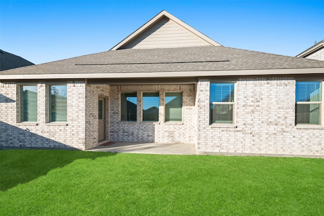 5836 Priory Dr, Celina, TX 76227 - rear view of house with a yard, a patio, brick siding, and a shingled roof
