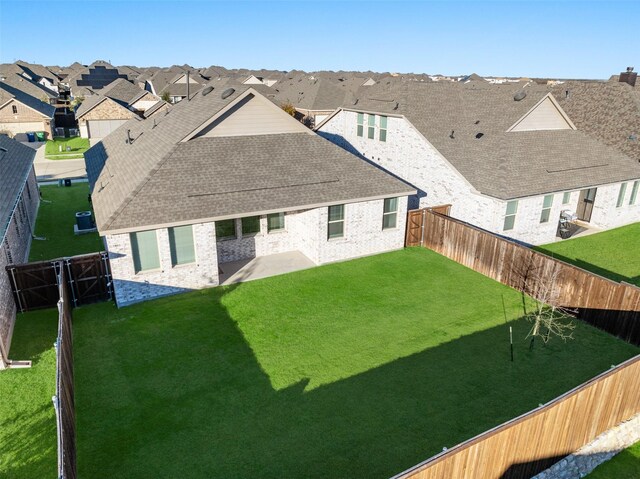 5836 Priory Dr, Celina, TX 76227 - rear view of house featuring a residential view, a patio area, roof with shingles, and brick siding