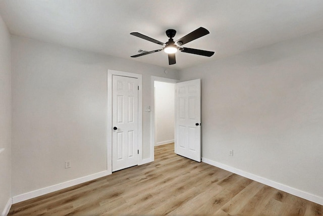 3103 Andrea Ln, Dallas, TX 75228 - unfurnished bedroom featuring wood finished floors and a ceiling fan