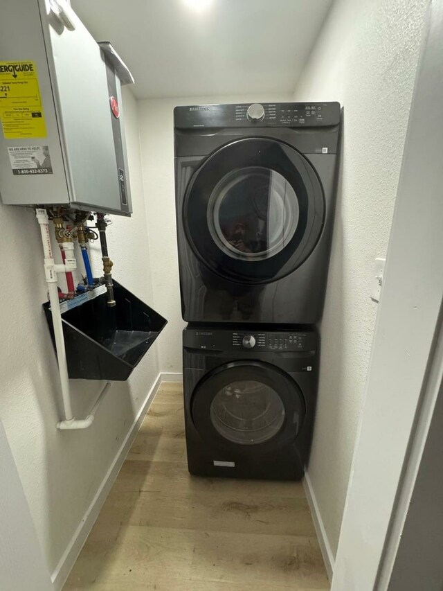 3103 Andrea Ln, Dallas, TX 75228 - washroom featuring water heater, hookup for an electric dryer, and washer hookup