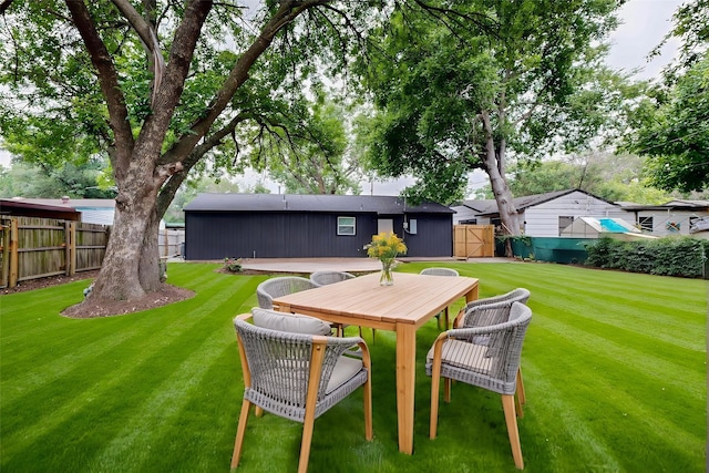 3103 Andrea Ln, Dallas, TX 75228 - rear view of house with a fenced backyard and outdoor dining space
