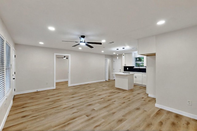3103 Andrea Ln, Dallas, TX 75228 - unfurnished living room featuring recessed lighting, light wood-style floors, and a ceiling fan