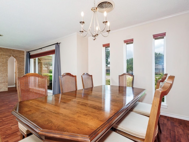 905 High Rd, Coleman, TX 76834 - dining space with arched walkways, dark wood-style flooring, a chandelier, ornamental molding, and baseboards