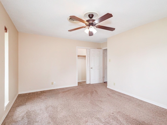 905 High Rd, Coleman, TX 76834 - unfurnished bedroom featuring carpet flooring, baseboards, a closet, and a ceiling fan