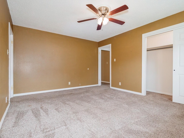 905 High Rd, Coleman, TX 76834 - unfurnished bedroom with carpet flooring, baseboards, a closet, and a ceiling fan