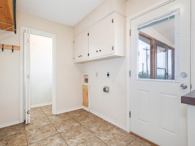 905 High Rd, Coleman, TX 76834 - laundry area with electric dryer hookup, cabinet space, baseboards, and hookup for a washing machine