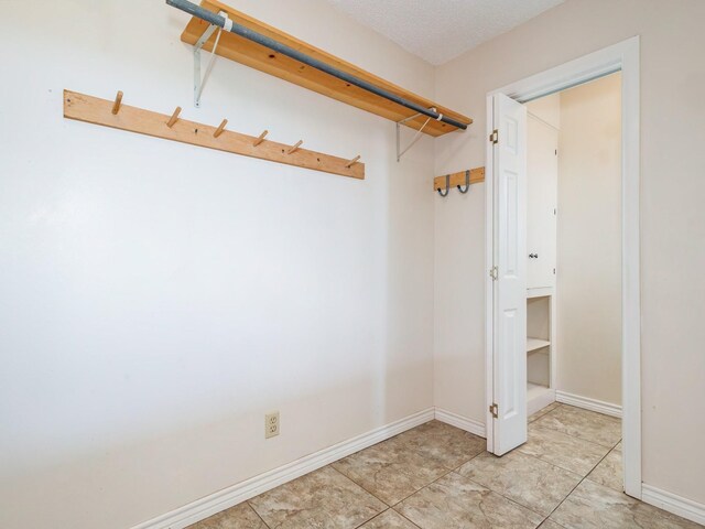 905 High Rd, Coleman, TX 76834 - spacious closet featuring light tile patterned floors