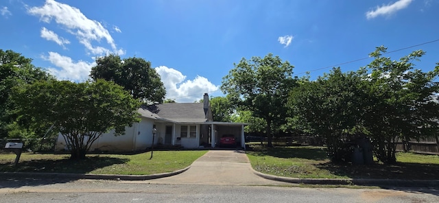 2821 Delaware Trl, Lake Worth, TX 76135 - view of front of property featuring concrete driveway, a carport, and a chimney