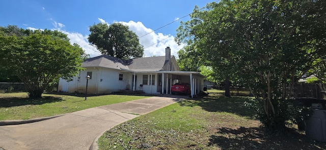 2821 Delaware Trl, Lake Worth, TX 76135 - view of front facade featuring driveway, a chimney, an attached carport, and stucco siding