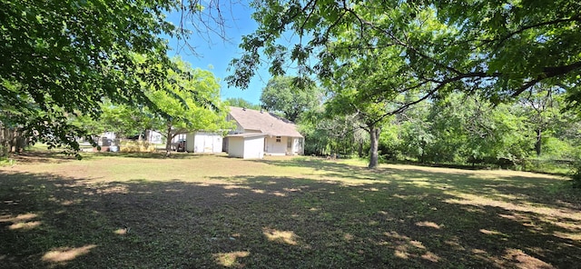 2821 Delaware Trl, Lake Worth, TX 76135 - view of grassy yard featuring an outdoor structure