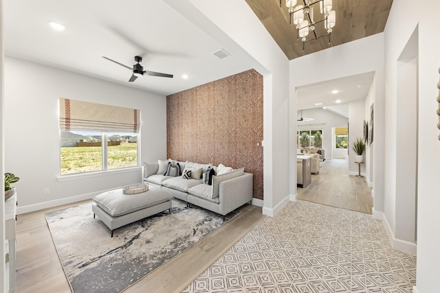 1015 Olympic Dr, Rockwall, TX 75087 - living area with a chandelier, ceiling fan, recessed lighting, baseboards, and light wood-style flooring