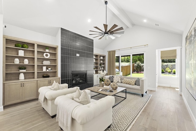1015 Olympic Dr, Rockwall, TX 75087 - living area featuring a large fireplace, light wood-type flooring, baseboards, recessed lighting, and a ceiling fan