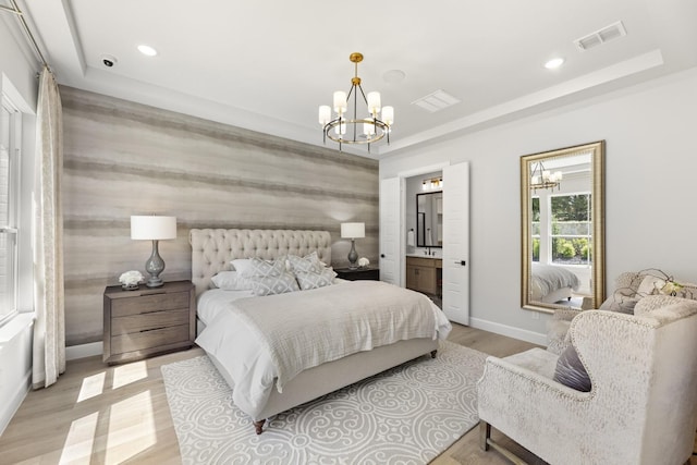 1015 Olympic Dr, Rockwall, TX 75087 - bedroom featuring a chandelier, a raised ceiling, baseboards, light wood-type flooring, and recessed lighting