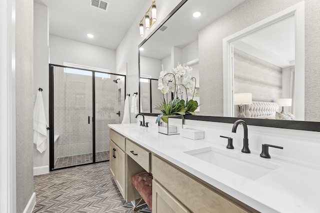 1015 Olympic Dr, Rockwall, TX 75087 - full bathroom with a stall shower, double vanity, recessed lighting, and baseboards