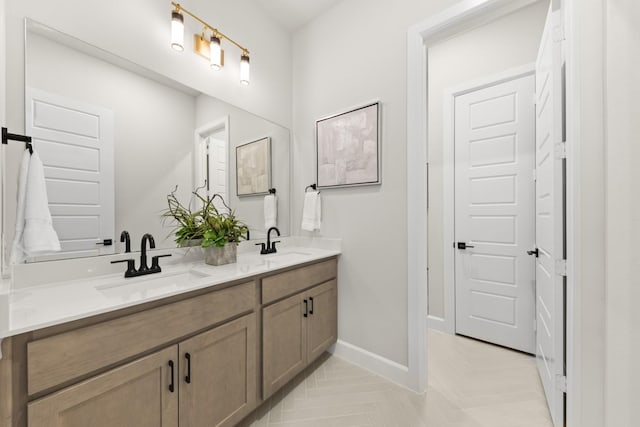 1015 Olympic Dr, Rockwall, TX 75087 - full bath with double vanity and baseboards