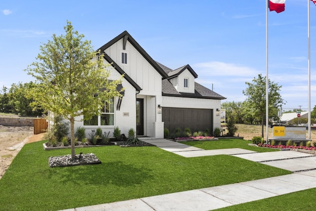 1015 Olympic Dr, Rockwall, TX 75087 - modern farmhouse with a front yard, roof with shingles, an attached garage, brick siding, and board and batten siding