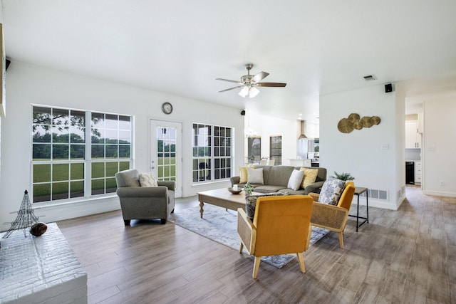 21 Graham Ln, Lucas, TX 75002 - living area with ceiling fan, wood finished floors, and baseboards