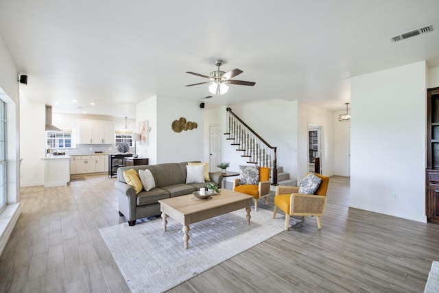 21 Graham Ln, Lucas, TX 75002 - living room featuring stairs, light wood-style floors, ceiling fan, baseboards, and recessed lighting
