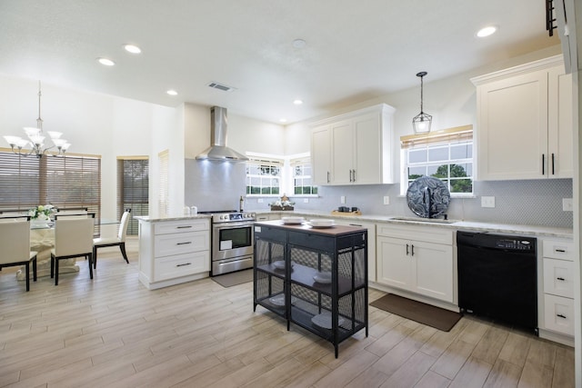 21 Graham Ln, Lucas, TX 75002 - kitchen with black dishwasher, stainless steel range with electric stovetop, wall chimney exhaust hood, light wood-style flooring, and recessed lighting