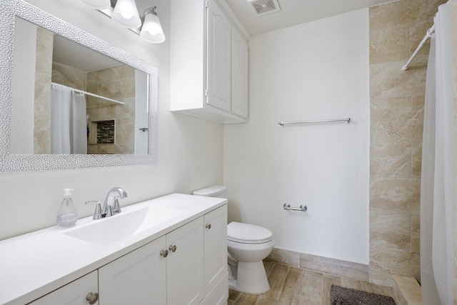 21 Graham Ln, Lucas, TX 75002 - bathroom with a tile shower, toilet, vanity, and wood finished floors