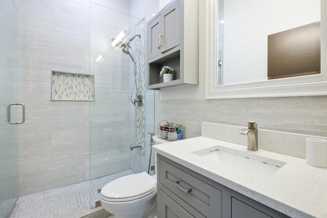 21 Graham Ln, Lucas, TX 75002 - bathroom featuring a stall shower, toilet, vanity, decorative backsplash, and tile walls