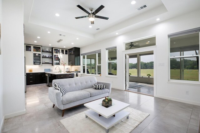 21 Graham Ln, Lucas, TX 75002 - living area with a ceiling fan, a raised ceiling, recessed lighting, and baseboards