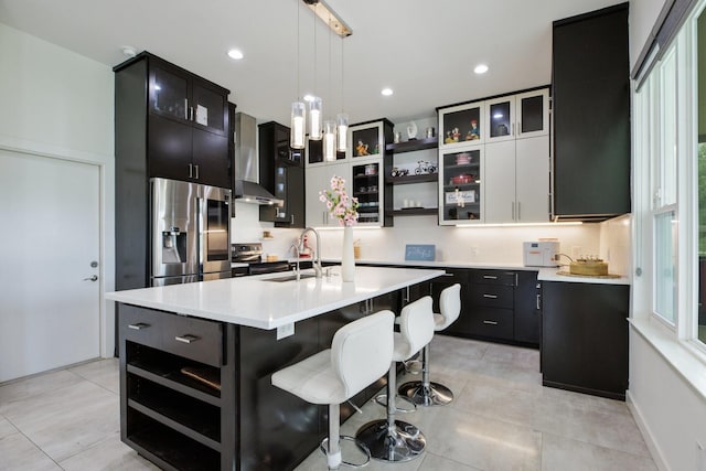 21 Graham Ln, Lucas, TX 75002 - kitchen featuring stainless steel fridge with ice dispenser, wall chimney exhaust hood, open shelves, light countertops, and dark cabinets