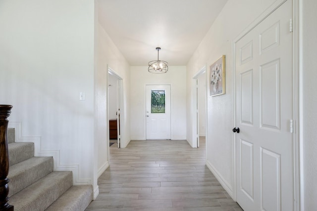 21 Graham Ln, Lucas, TX 75002 - entryway featuring light wood-type flooring, baseboards, a chandelier, and stairs