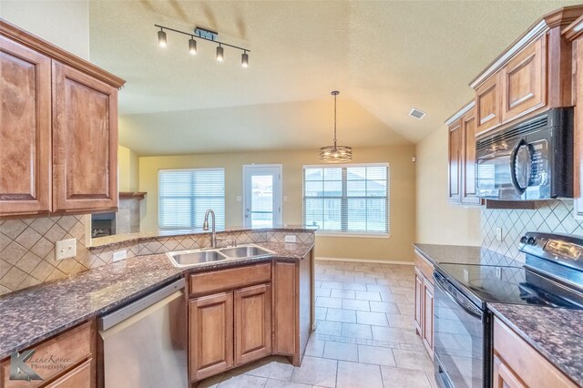 210 Miss Ellie Ln, Abilene, TX 79602 - kitchen featuring electric range oven, stainless steel dishwasher, a sink, black microwave, and brown cabinets