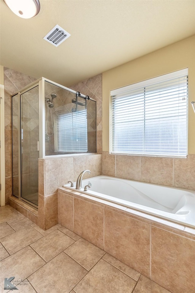 210 Miss Ellie Ln, Abilene, TX 79602 - full bathroom featuring a stall shower, a garden tub, and tile patterned flooring