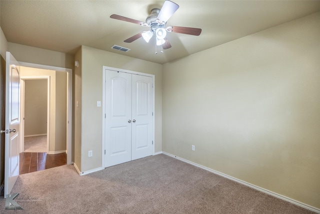 210 Miss Ellie Ln, Abilene, TX 79602 - unfurnished bedroom with carpet flooring, a closet, baseboards, and ceiling fan