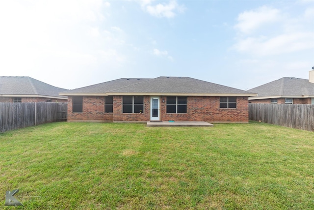 210 Miss Ellie Ln, Abilene, TX 79602 - back of house featuring brick siding, a patio, and a shingled roof