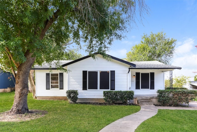 1316 Guthrie Dr, Waco, TX 76710 - view of front of home featuring a front yard, roof with shingles, and a porch