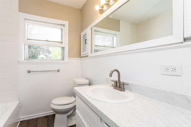 1316 Guthrie Dr, Waco, TX 76710 - bathroom with toilet, wood finished floors, and vanity